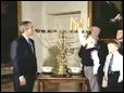 President George W. Bush watches the Menorah lighting.